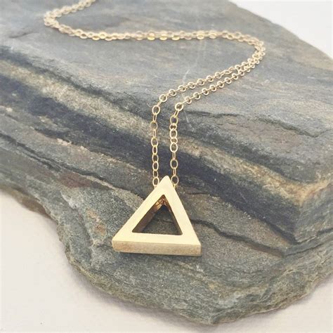 necklace with triangle pendant.